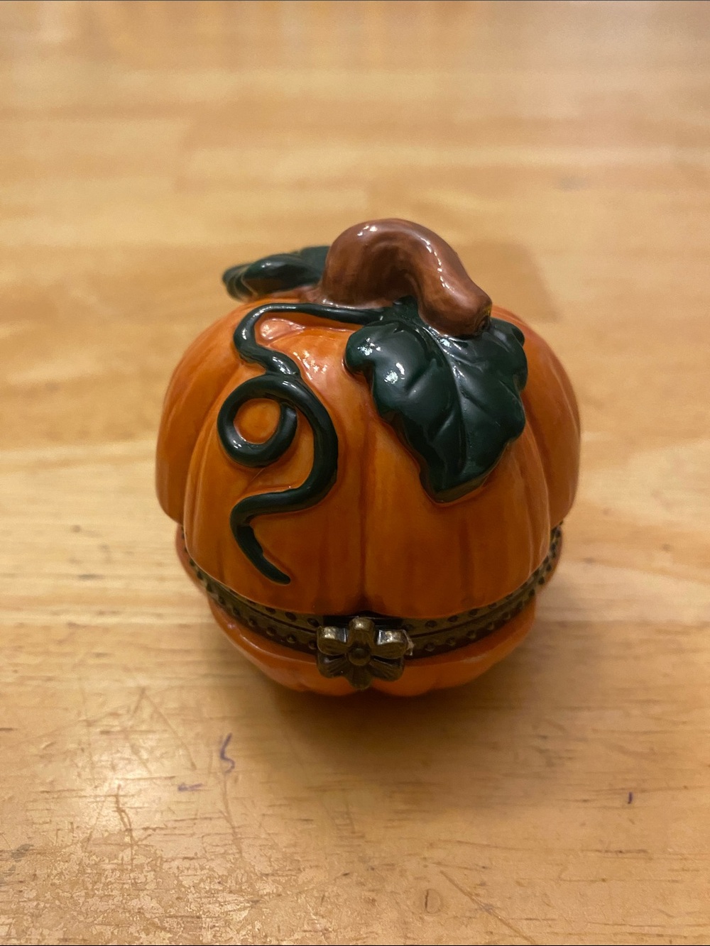 Ceramic Orange Pumpkin Trinket Box with Green Leaf Accent. Halloween decor